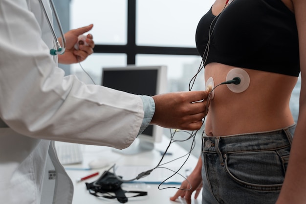 Side view doctor checking patient