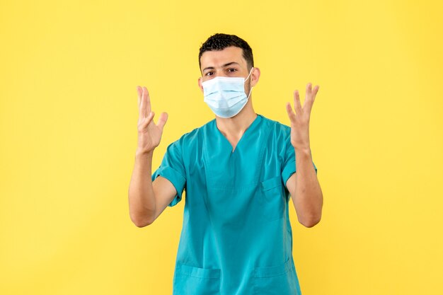 Side view a doctor a doctor in mask talks about the patients with serious infections