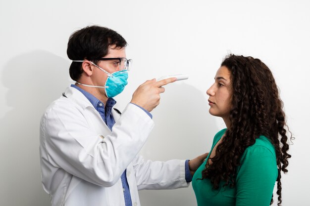 Side view doctor examining woman