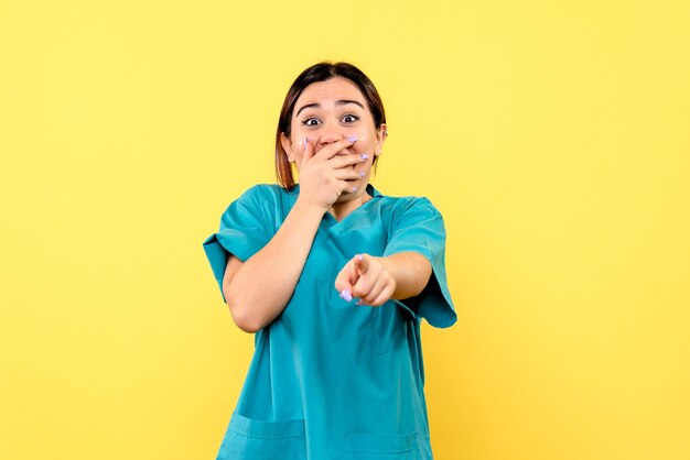 Side view of a doctor is surprised by behavior of the patient