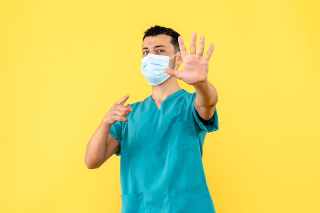 Side view of a doctor in mask encourages people to wash hands