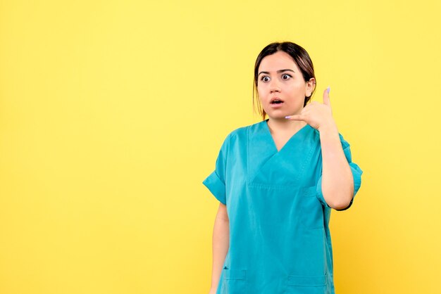 Side view of a doctor tells the patient to call her