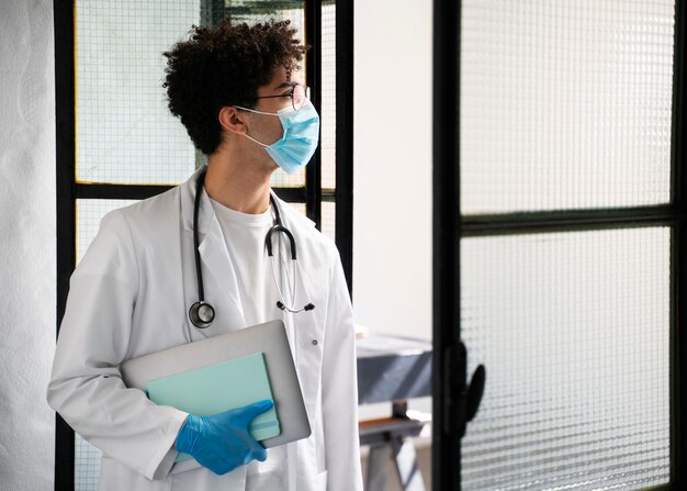 Side view doctor wearing face mask