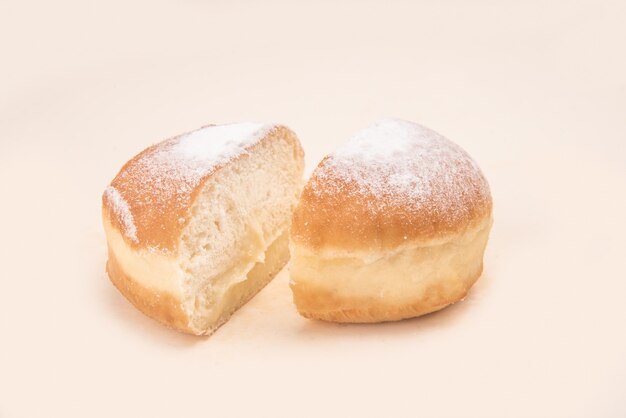 Side view of donut with powder