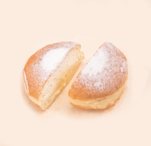 Side view of donut with powder