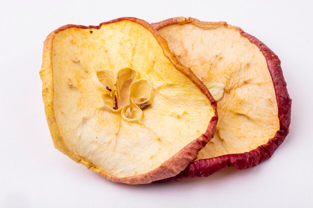 Side view of dried apple slices isolated on white background