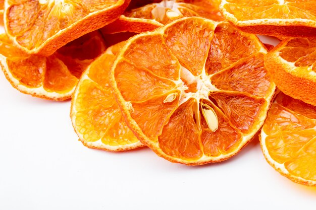 Side view of dried orange slices isolated on white background