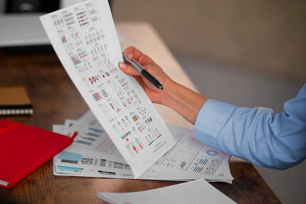 Side view economist holding paper