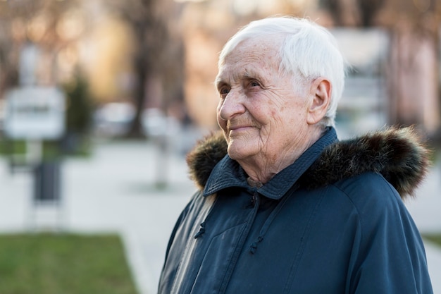 Side view of elder woman in the city