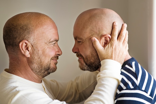 Free photo side view elderly men being romantic