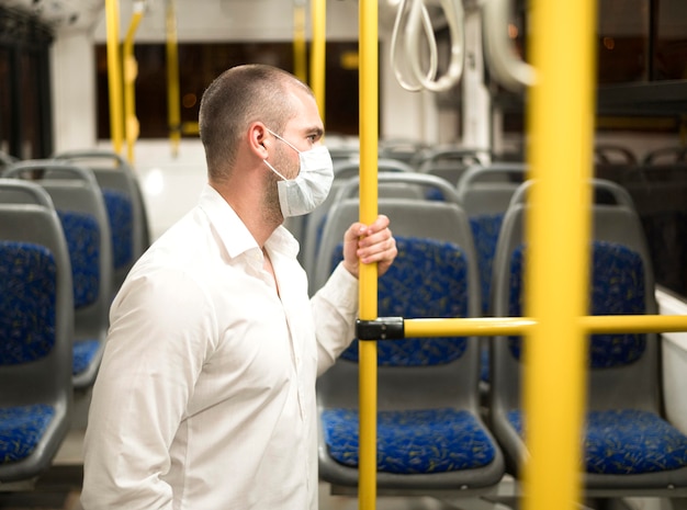 Free photo side view elegant male with face mask