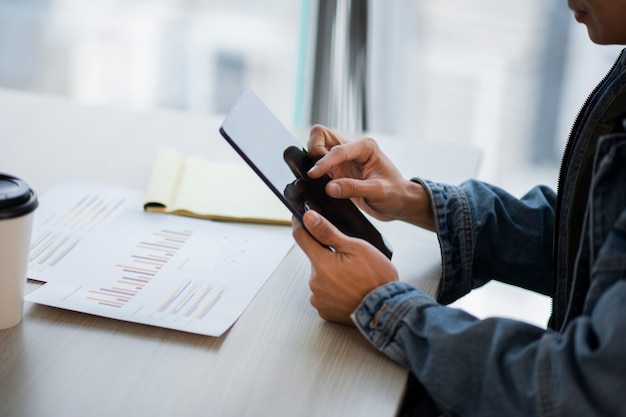 Side view employee holding tablet