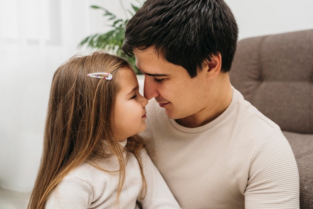 Side view of father and daughter spending time together