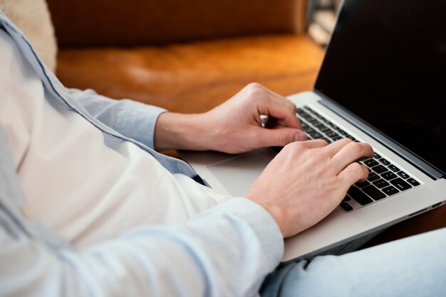 Side view of father working on laptop