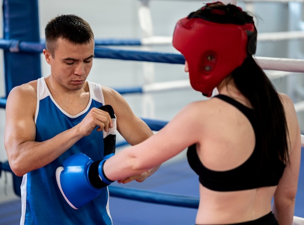 Side view of female boxer getting ready for training