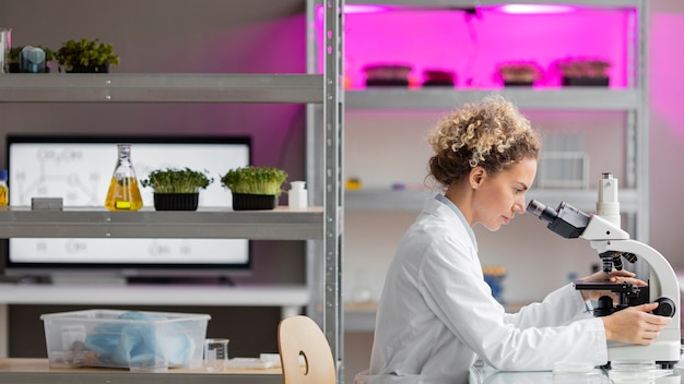 Side view of female researcher in the laboratory