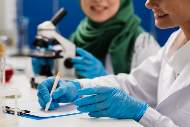 Side view of female scientists at work in the lab