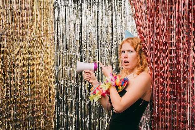 Side view female with megaphone at carnival party