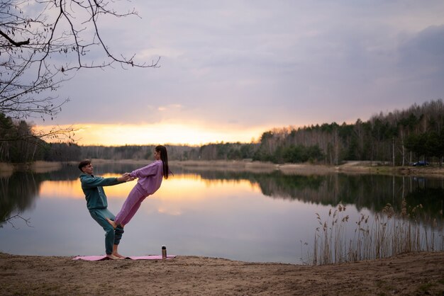 Side view fit couple training outdoors