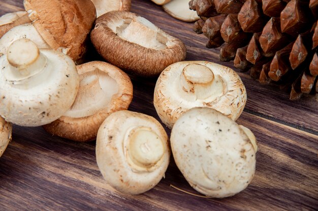 side view of fresh mushrooms on wooden rustic surface