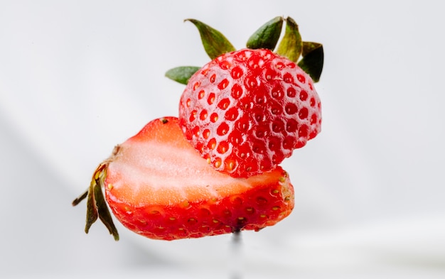 Side view fresh strawberry on white background