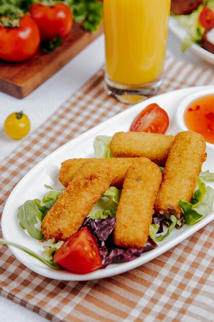 Side view of fried cheese sticks on the table