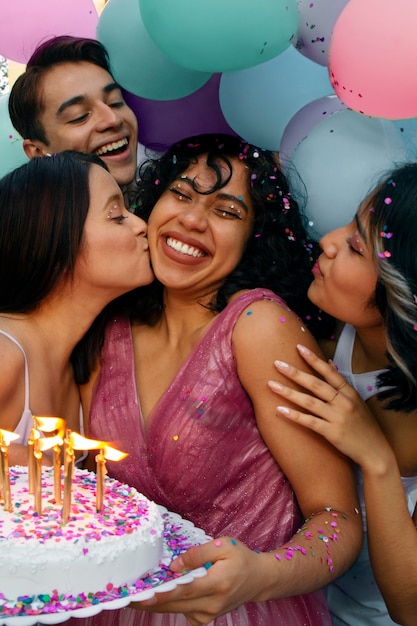 Side view friend kissing woman on cheek