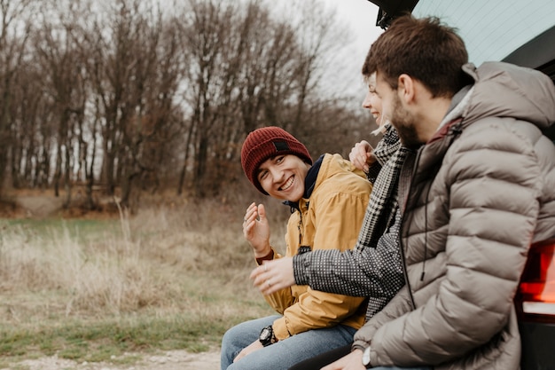 Side view friends laughing together