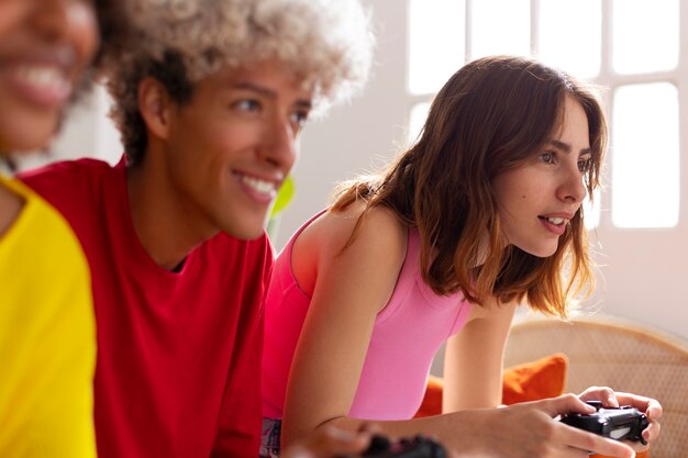 Side view friends playing videogames