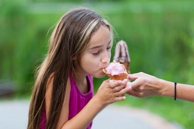 Side view of girl eating ice cream