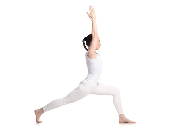 Side view of girl practicing yoga