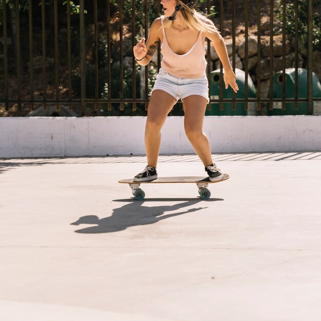 Side view of girl skating