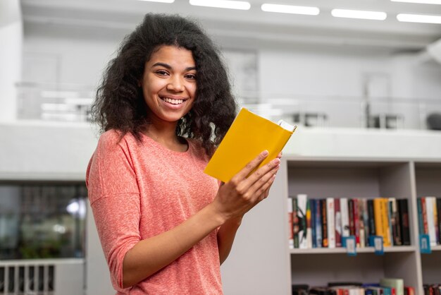 Side view girl studying at library