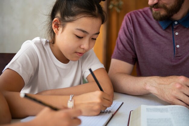 Side view girl taking notes