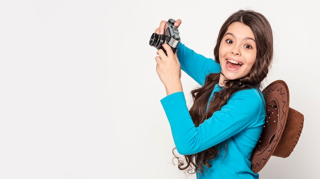 Side view girl with camera