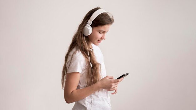 Side view girl with headphones