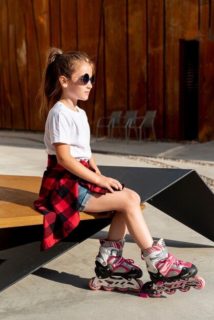 Side view of girl with inline skates