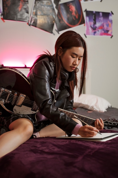 Side view girl writing music