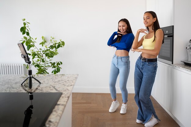 Side view  girls dancing together