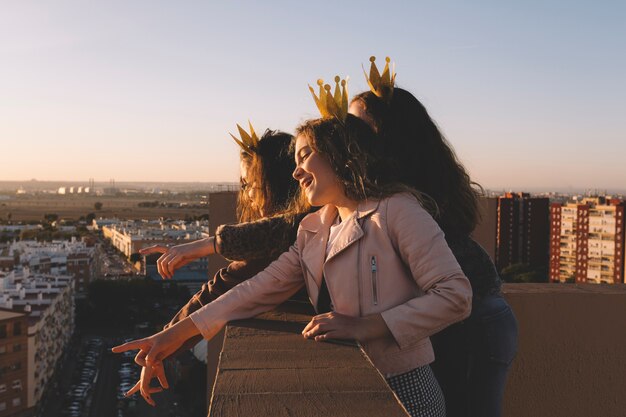 Side view girls on roof