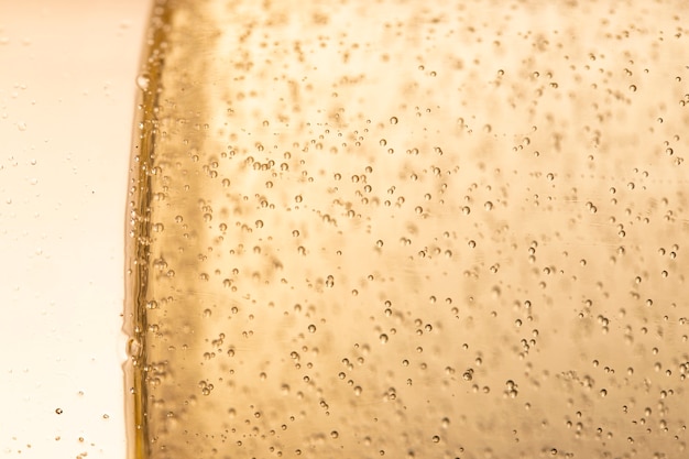 Side view glass with champagne bubbles