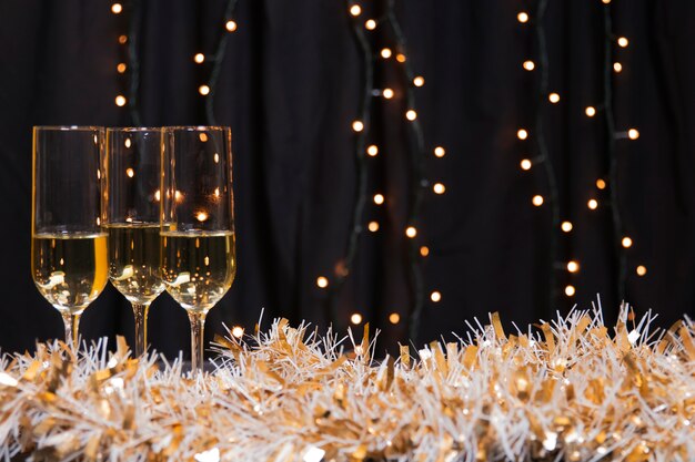 Side view glasses with champagne for new year