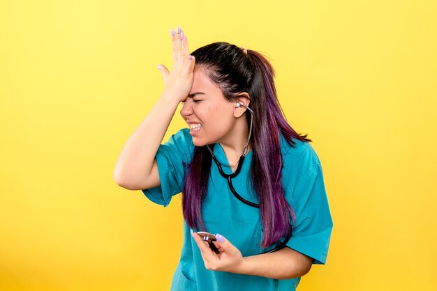 Side view of the good doctor with phonendoscope worries about patients