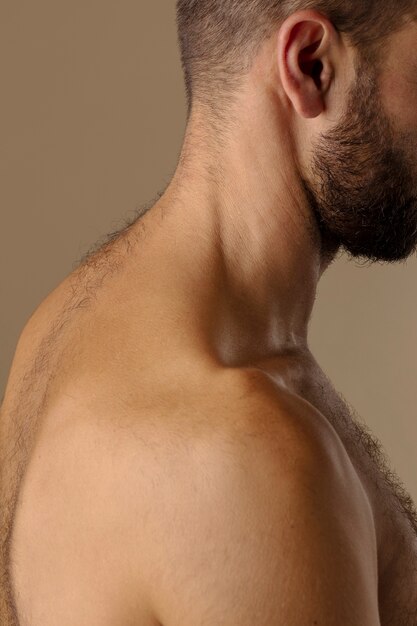 side view hairy man in studio