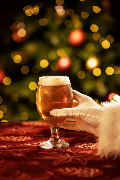 Side view hand holding christmas beer