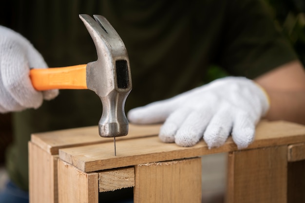 Free photo side view hand holding hammer