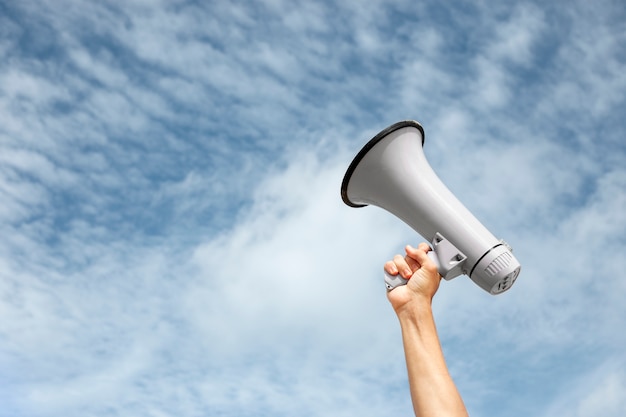 Side view hand holding megaphone