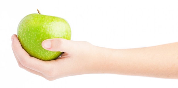 Side view of hand with a green apple