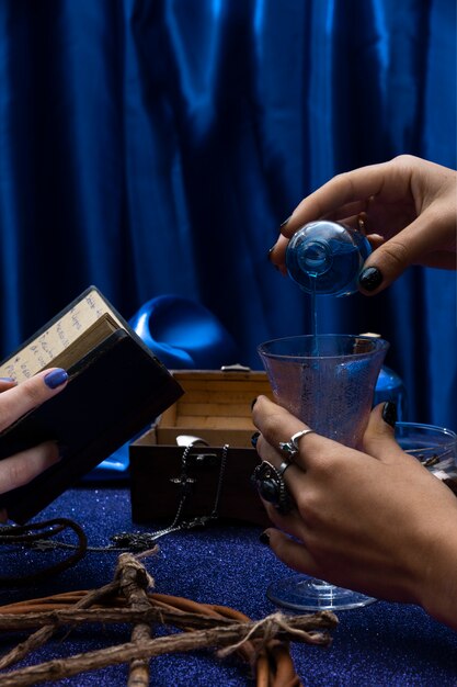 Side view hands holding cup and book