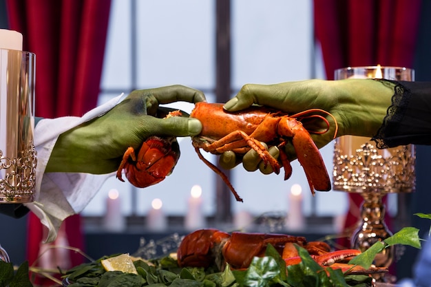 Free photo side view hands holding lobster